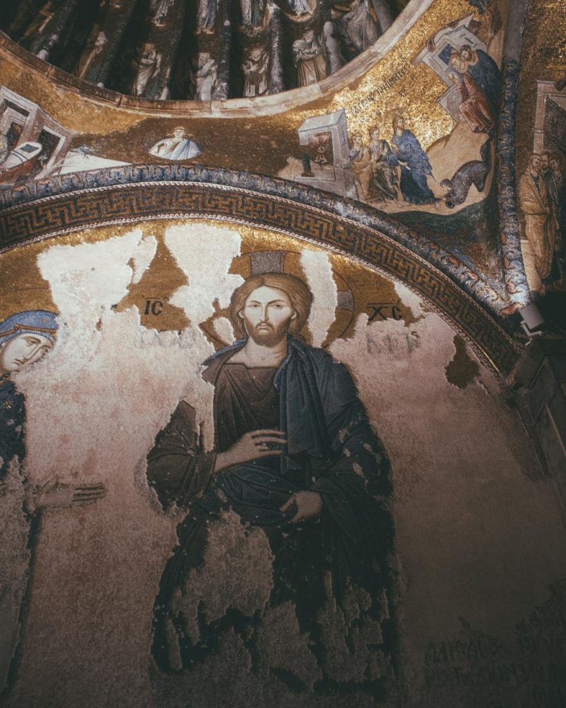 A stunning mural of Jesus Christ within a church dome, showcasing Renaissance religious art.